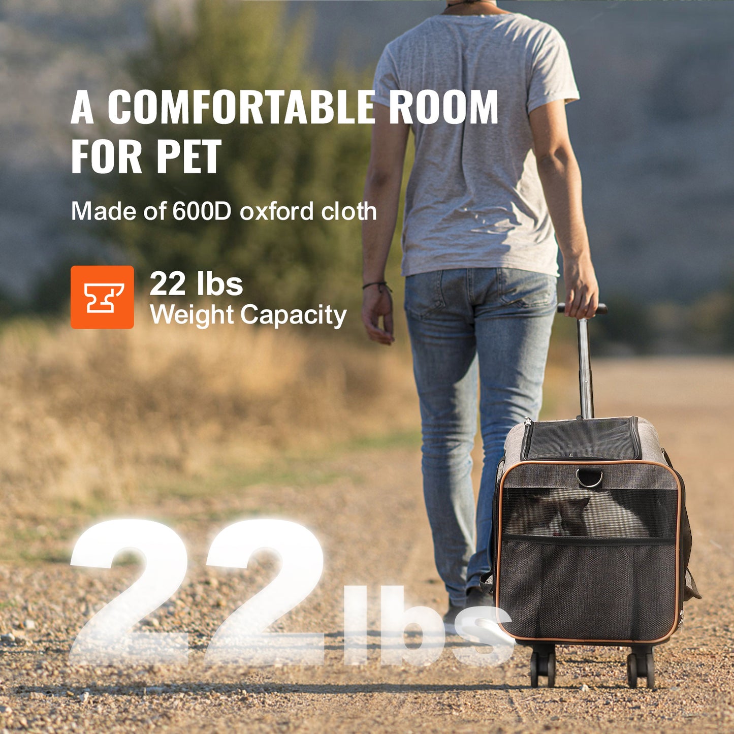 Person walking with a pet carrier on a dirt path, highlighting weight capacity.