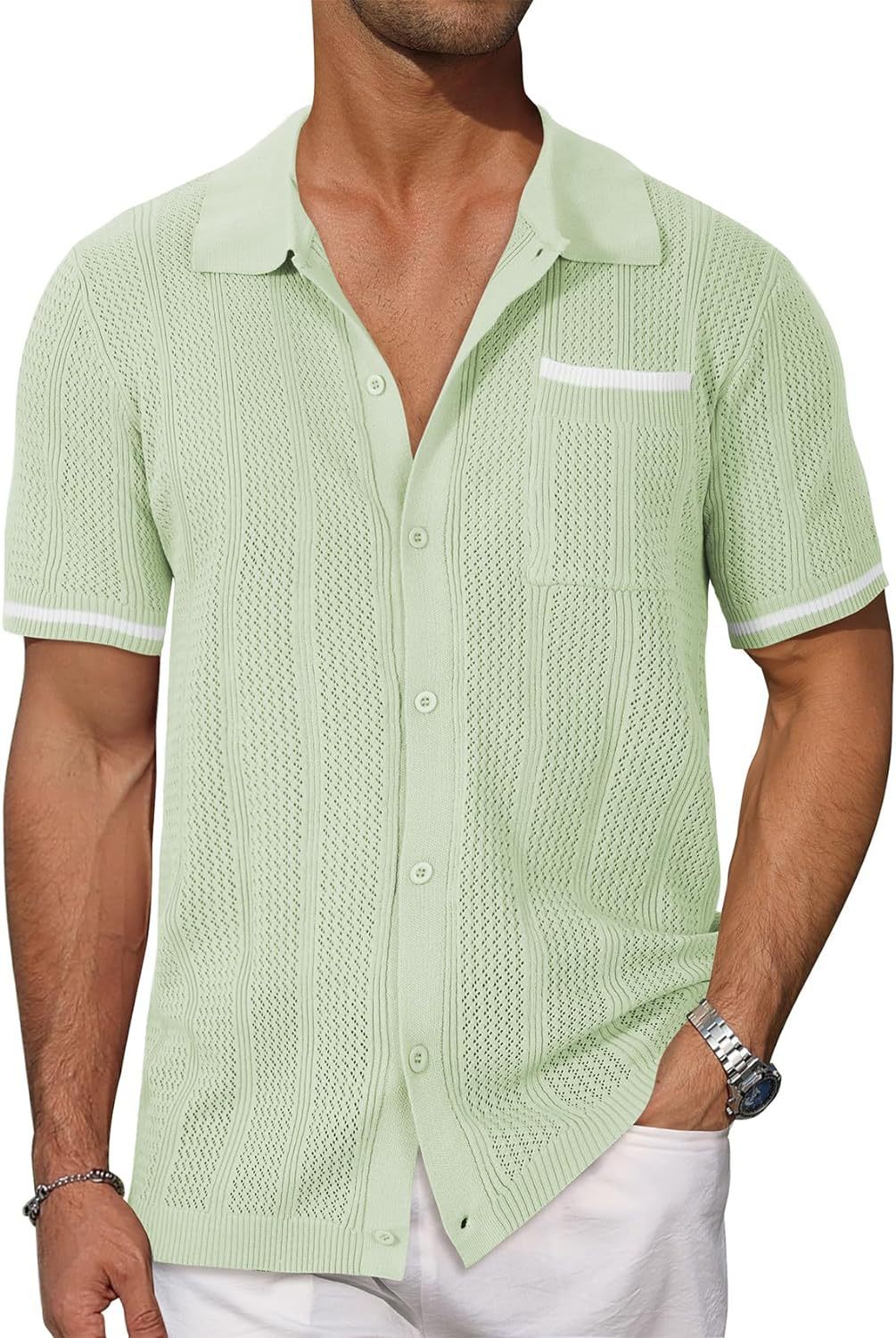 Man wearing a light green textured short-sleeve shirt on a white background