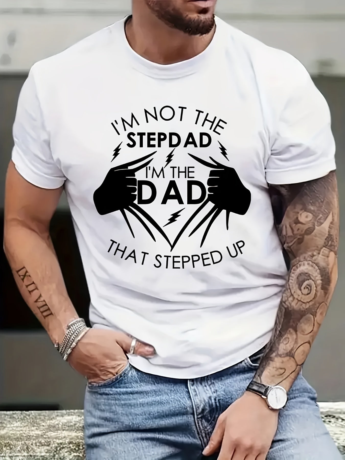 Person wearing a white t-shirt with a humorous message about stepping up as a father.