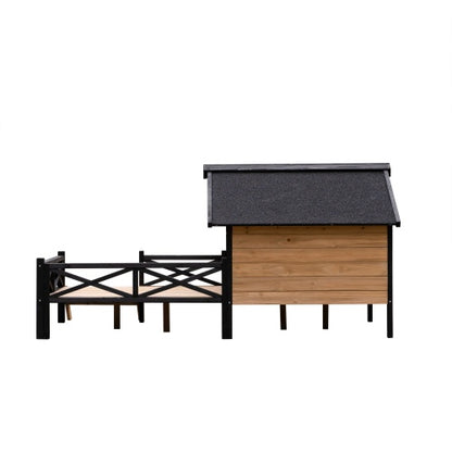 Wooden dog house with black roof and fence on a white background