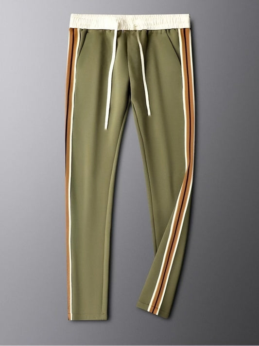 Green pants with side stripes on a gray background