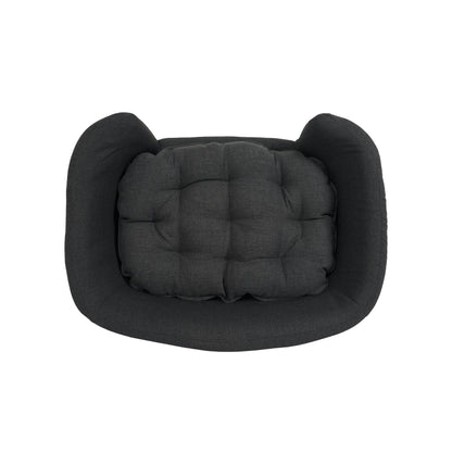 Dark gray pet bed with a cushion on a white background