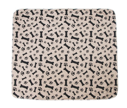 Patterned mat with black bones and paw prints on a beige background