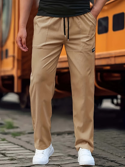 Person wearing beige pants with a blurred background