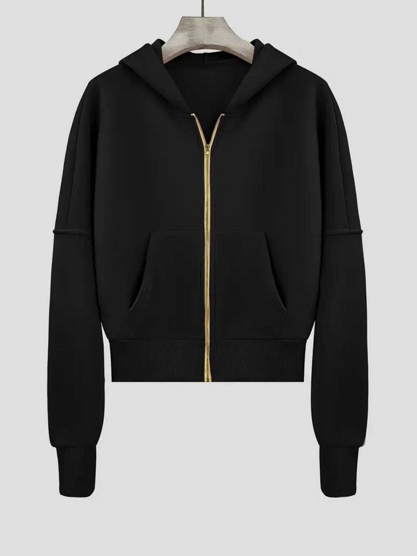 Black hoodie with a gold zipper on a white background