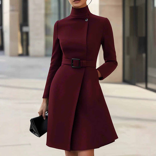 Burgundy dress with a belt worn by a person in an urban setting