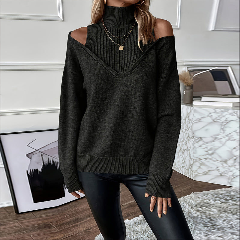 Person wearing a dark green off-shoulder sweater in an indoor setting.