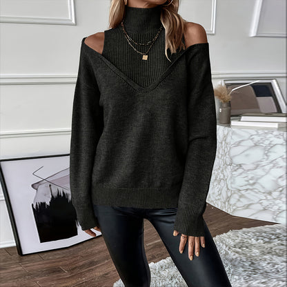 Person wearing a dark green off-shoulder sweater in an indoor setting.