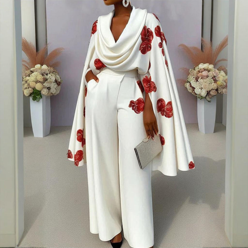 White outfit with red floral patterns worn by a model in a neutral setting