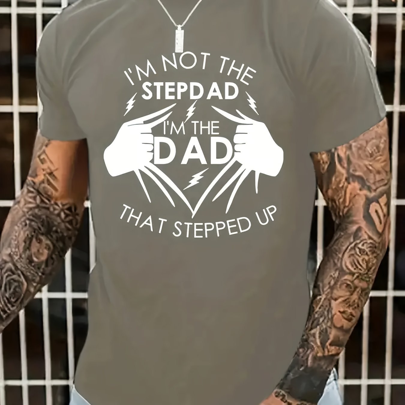 Person wearing a t-shirt with a humorous message about being a stepdad.