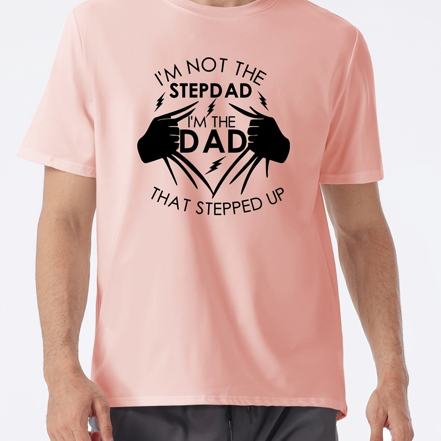 Pink t-shirt with black text and graphic design on a white background