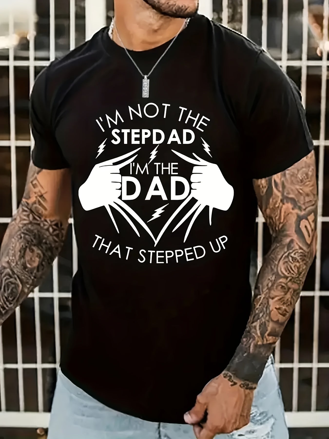 Person wearing a black t-shirt with a humorous graphic and text.