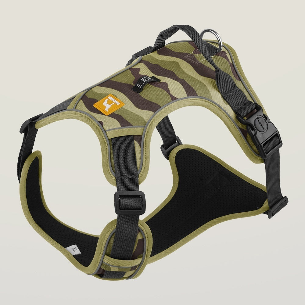 Camouflage dog harness with black straps on a beige background
