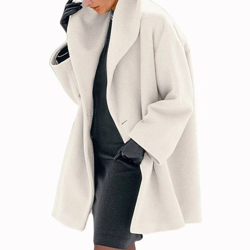 White coat worn by a person on a white background