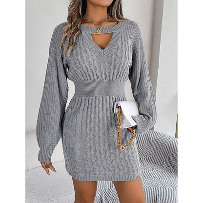 Gray knitted dress worn by a model with a white background