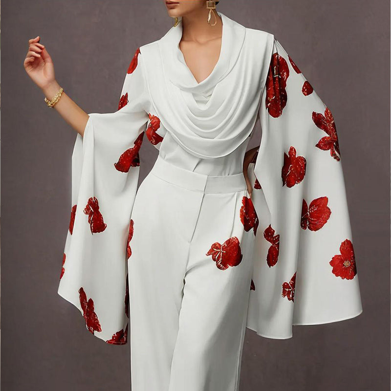 White outfit with red floral patterns on a plain background