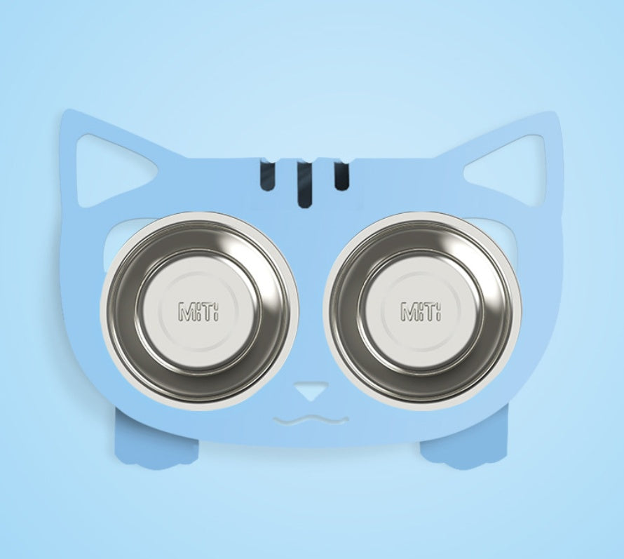 Blue cat-shaped pet feeder with two stainless steel bowls on a light blue background