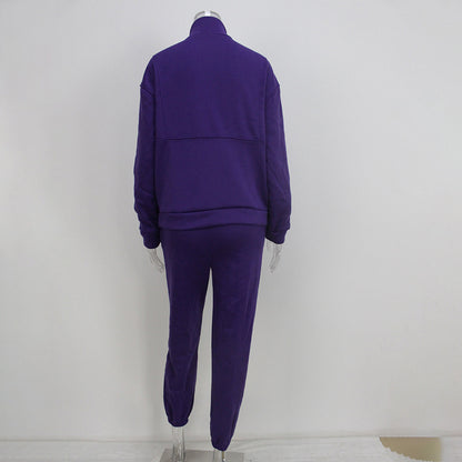 Purple tracksuit on a mannequin against a white background