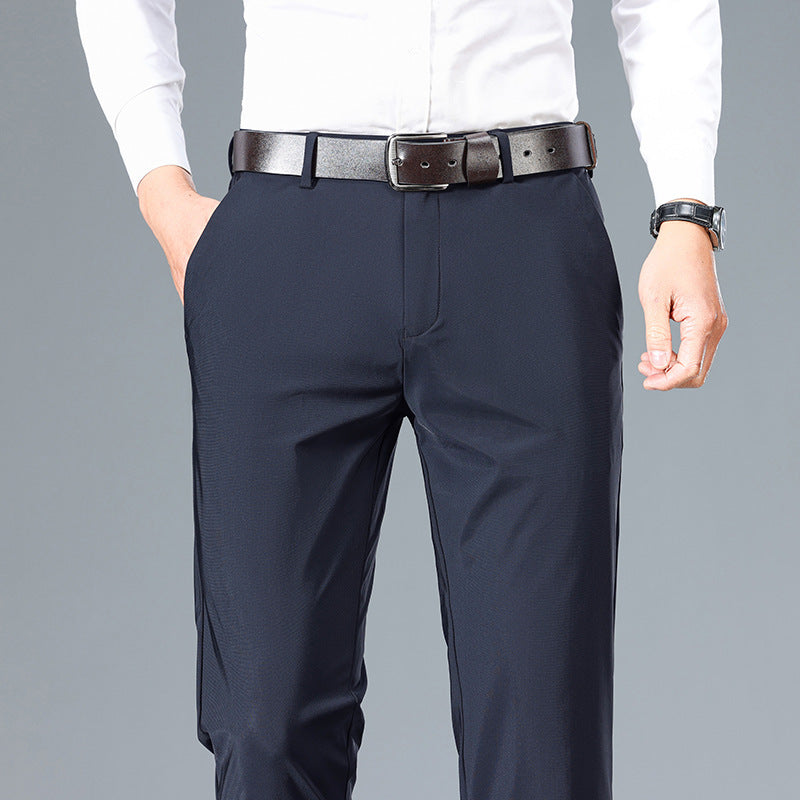 Navy pants with a white shirt on a gray background