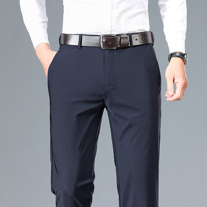 Navy pants with a white shirt on a gray background