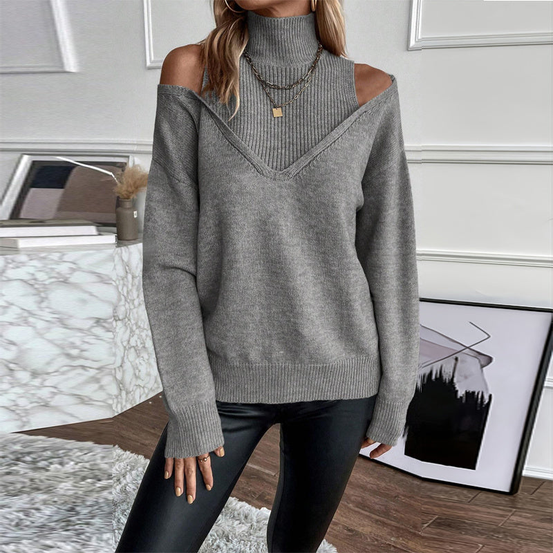 Person wearing a gray off-shoulder sweater in an indoor setting.