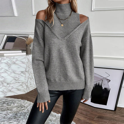 Person wearing a gray off-shoulder sweater in an indoor setting.