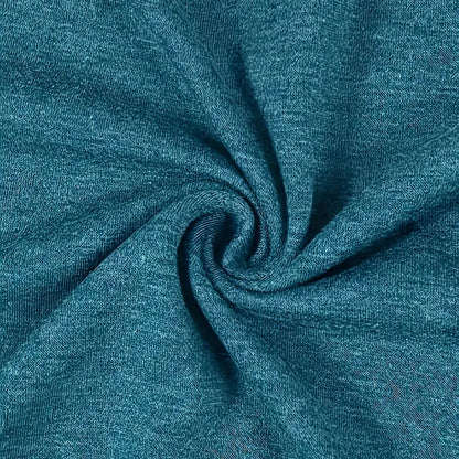 Close-up of teal fabric with a swirl pattern