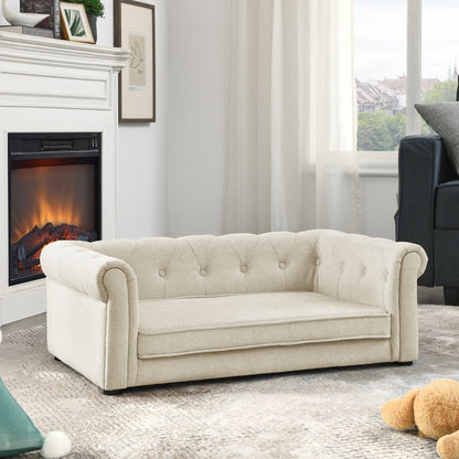 Beige sofa in a living room with a fireplace and window