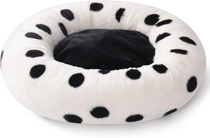 White pet bed with black paw prints on a white background