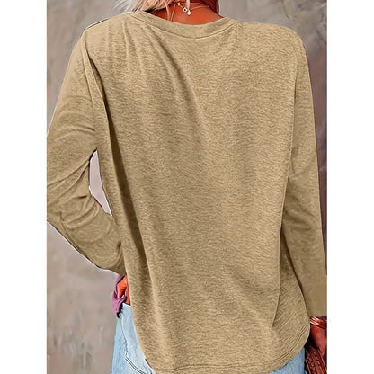 Beige long-sleeve shirt worn by a person with a neutral background