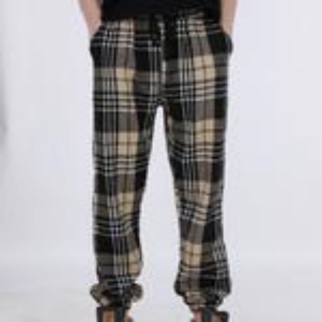 Plaid pants worn by a person on a white background