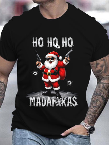 Black t-shirt with a graphic of Santa Claus holding guns and text 'HO HO HO MADAFAKAS' worn by a person.