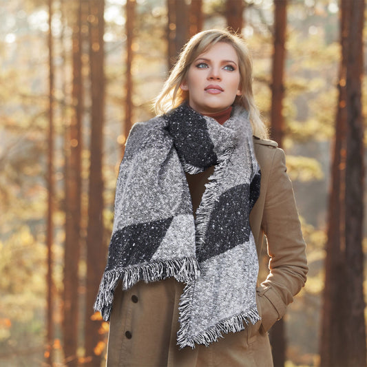 Woman wearing a patterned scarf in a forest setting