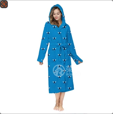 Blue robe with black patterns worn by a model on a white background