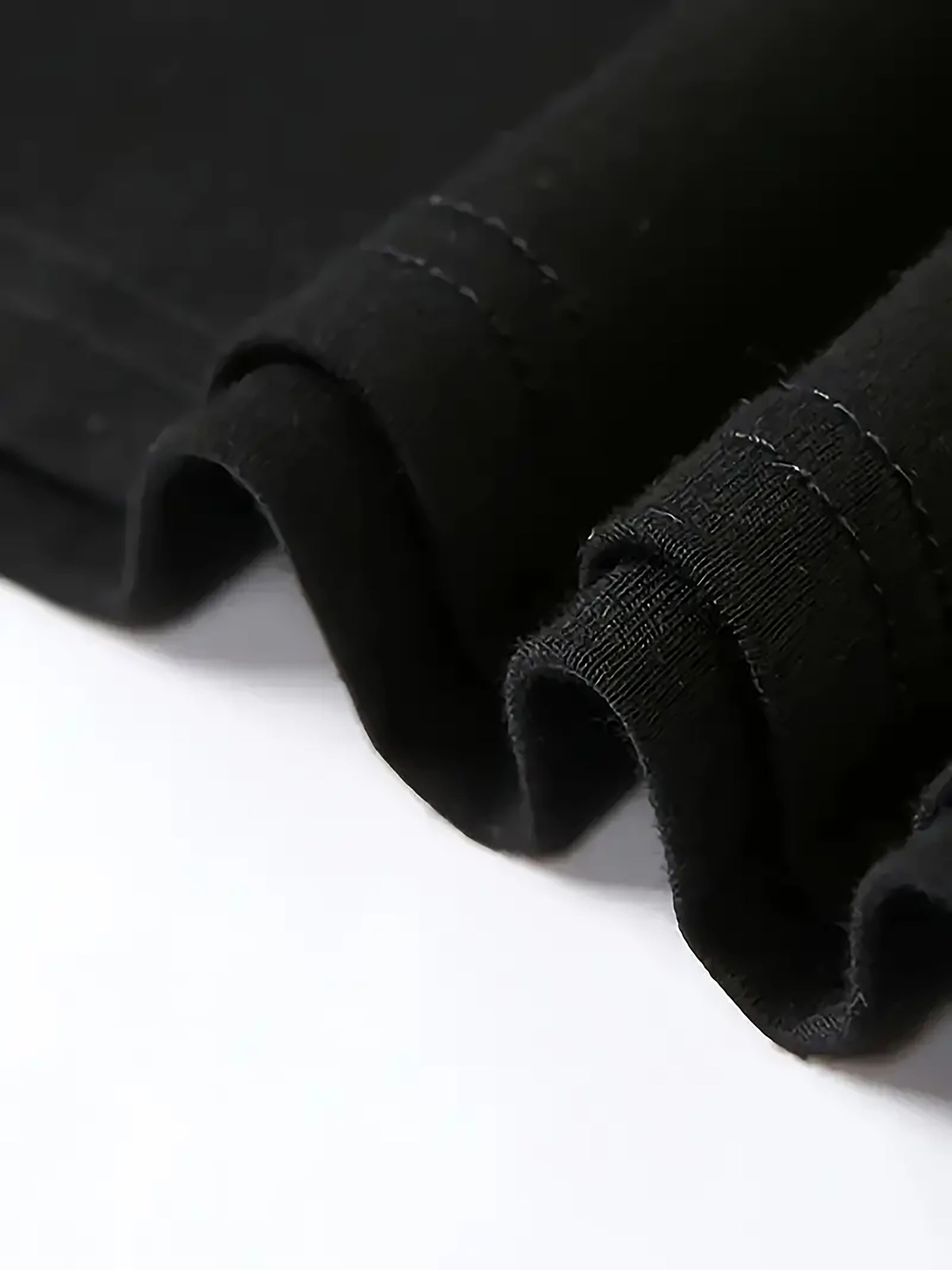 Close-up of black fabric on a white background