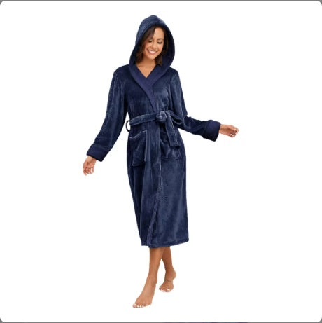 Woman wearing a navy blue hooded robe on a white background