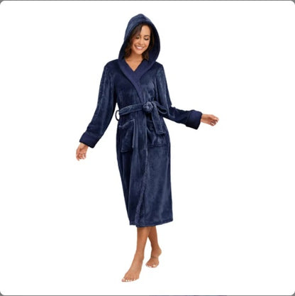 Woman wearing a navy blue hooded robe on a white background