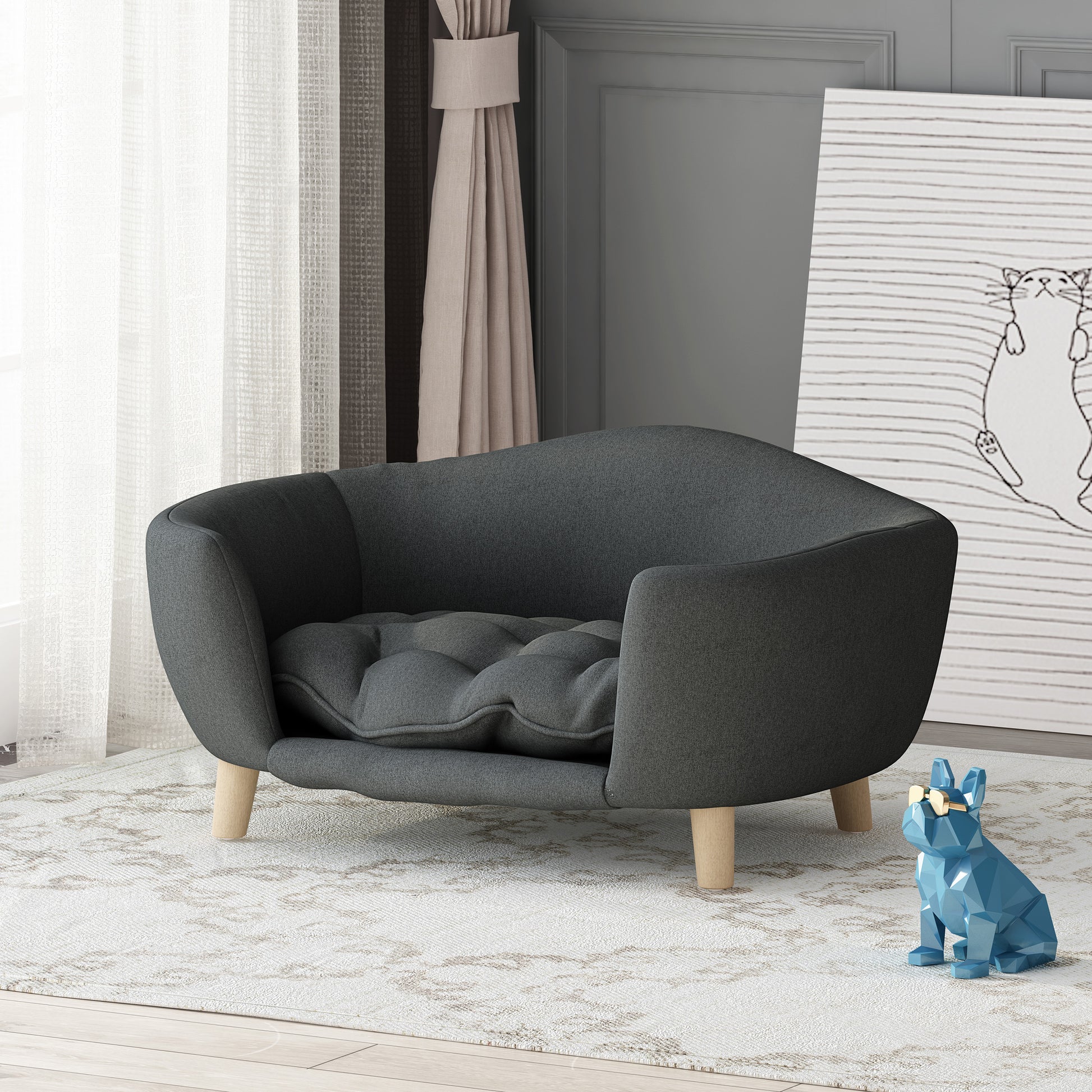 Gray pet sofa in a room with a blue statue and white wall.