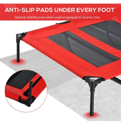 Red and black trampoline with anti-slip pads on a gray surface