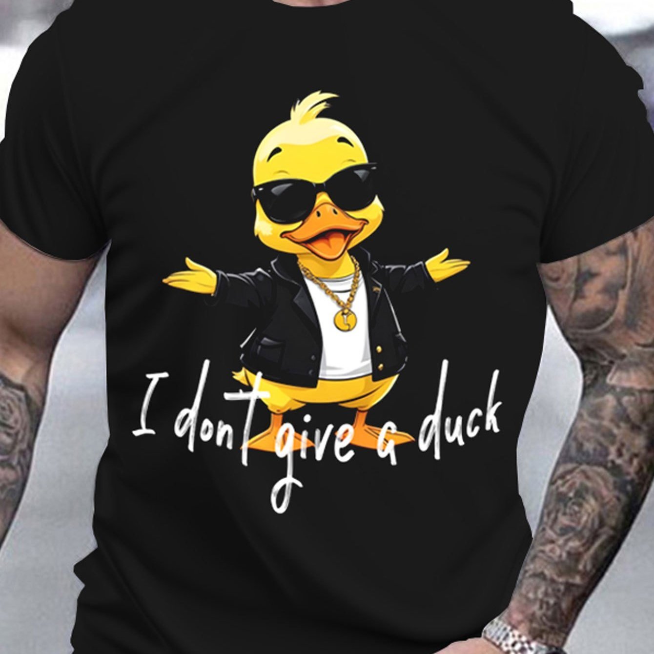 Black t-shirt with a yellow duck wearing sunglasses and a black jacket graphic and text 'I don't give a duck'.