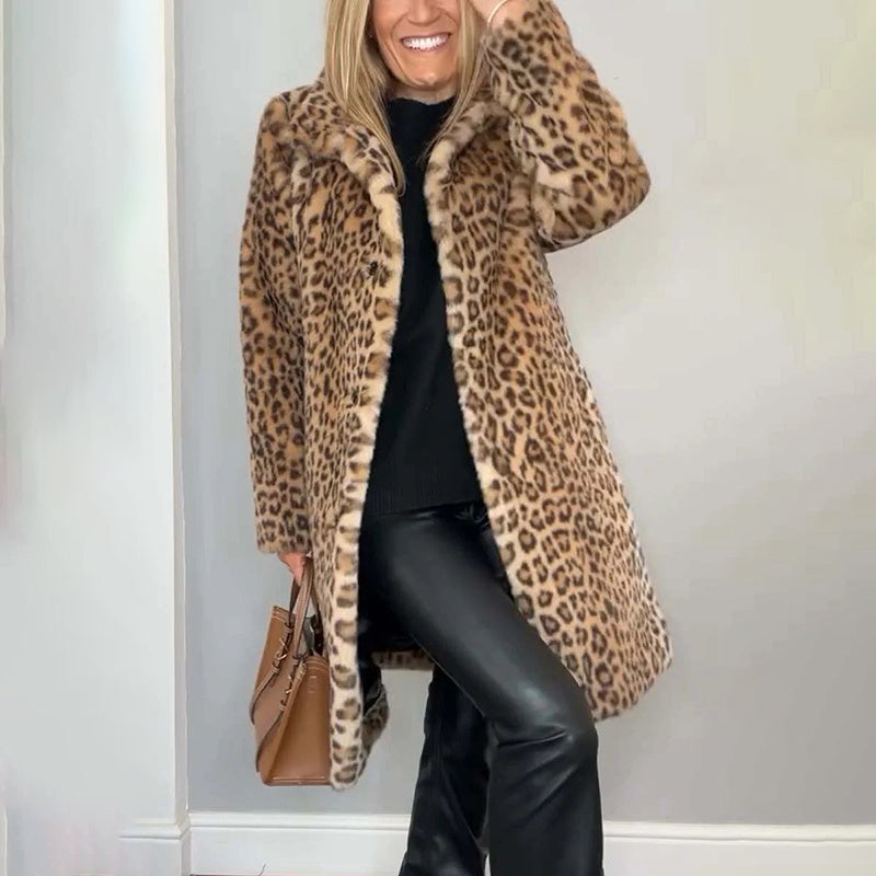Person wearing a leopard print coat with a plain background