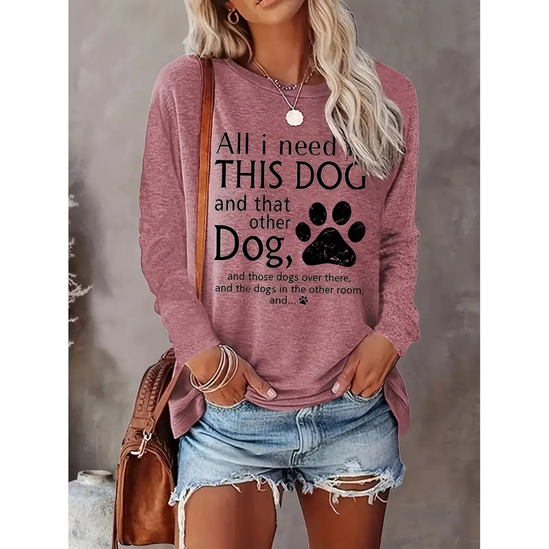 Person wearing a pink sweatshirt with a humorous dog-themed text design.