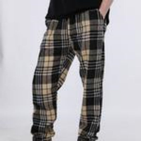 Plaid pants worn by a person on a white background
