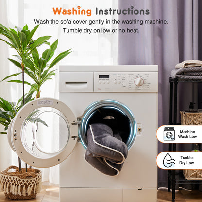 Washing machine with a gray sofa cover inside, surrounded by a plant and a shelf with folded clothes.