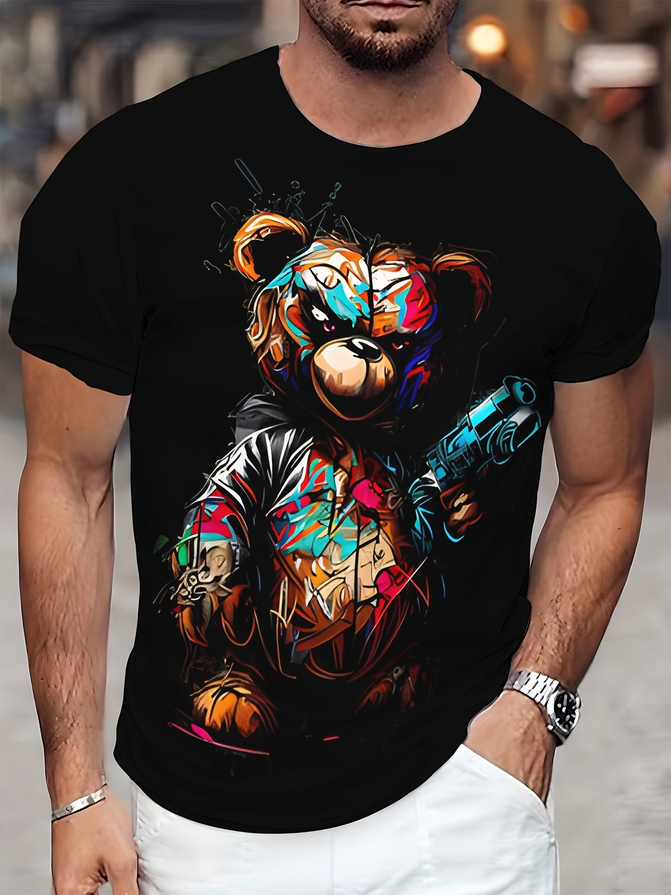 Person wearing a black t-shirt with a colorful bear graphic design.