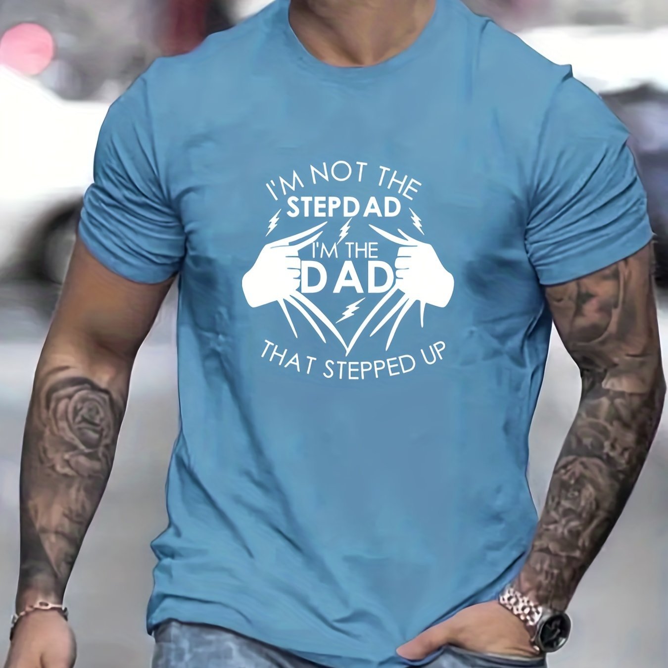 Person wearing a blue t-shirt with a humorous graphic and text.