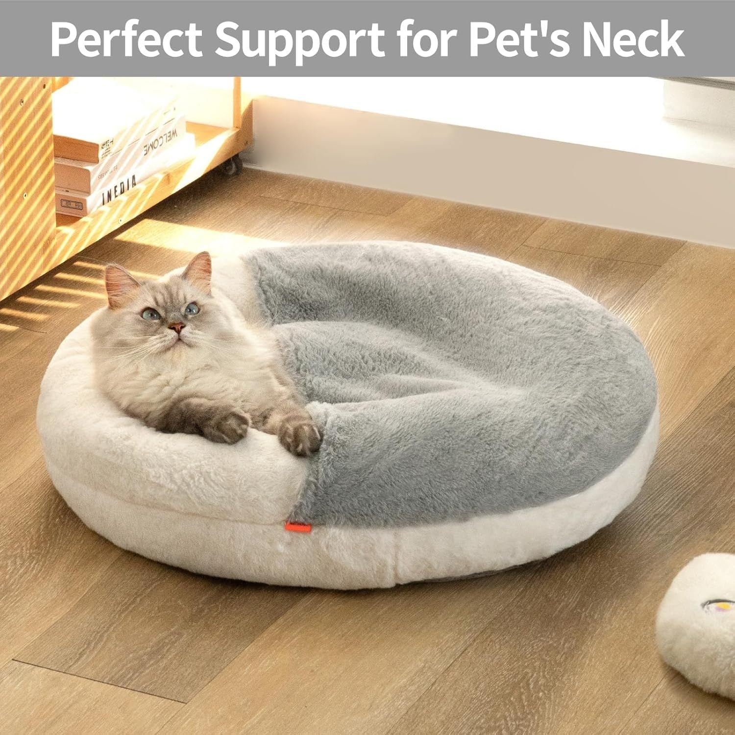 Cat lying on a round pet bed with 'Perfect Support for Pet's Neck' text above.