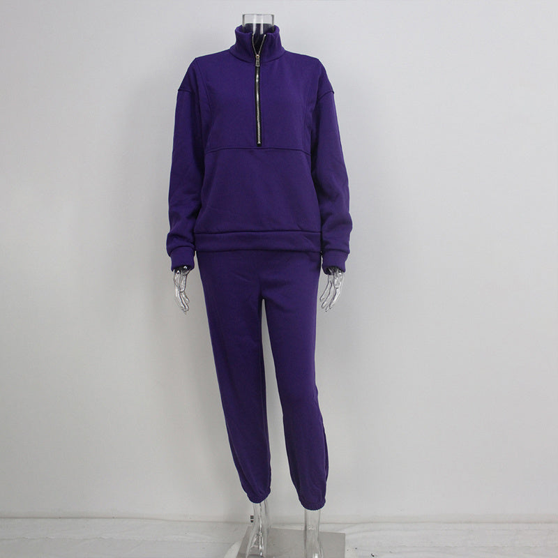 Purple tracksuit on a mannequin against a white background