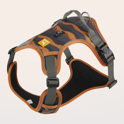 Dog harness with orange and black design on a beige background
