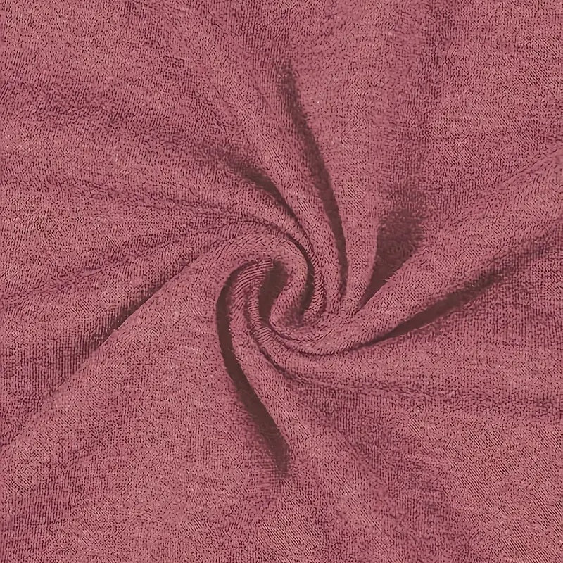Close-up of pink fabric with a swirl pattern
